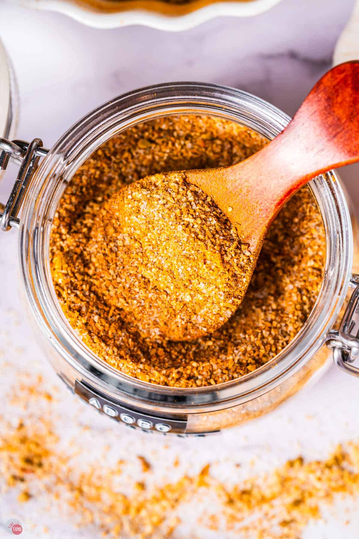 close up of adobo seasoning in a mason jar