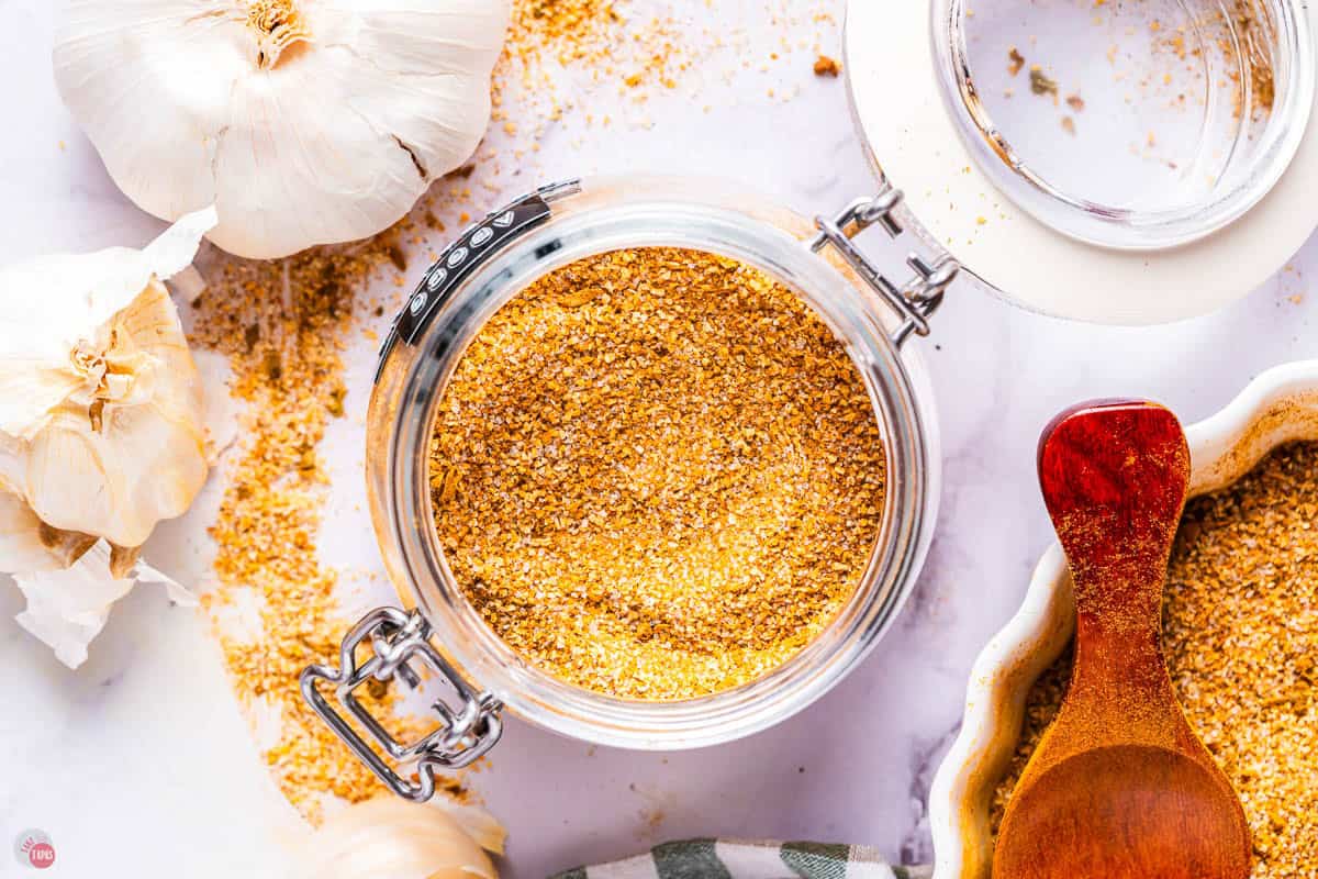 open jar of yellow spice mix