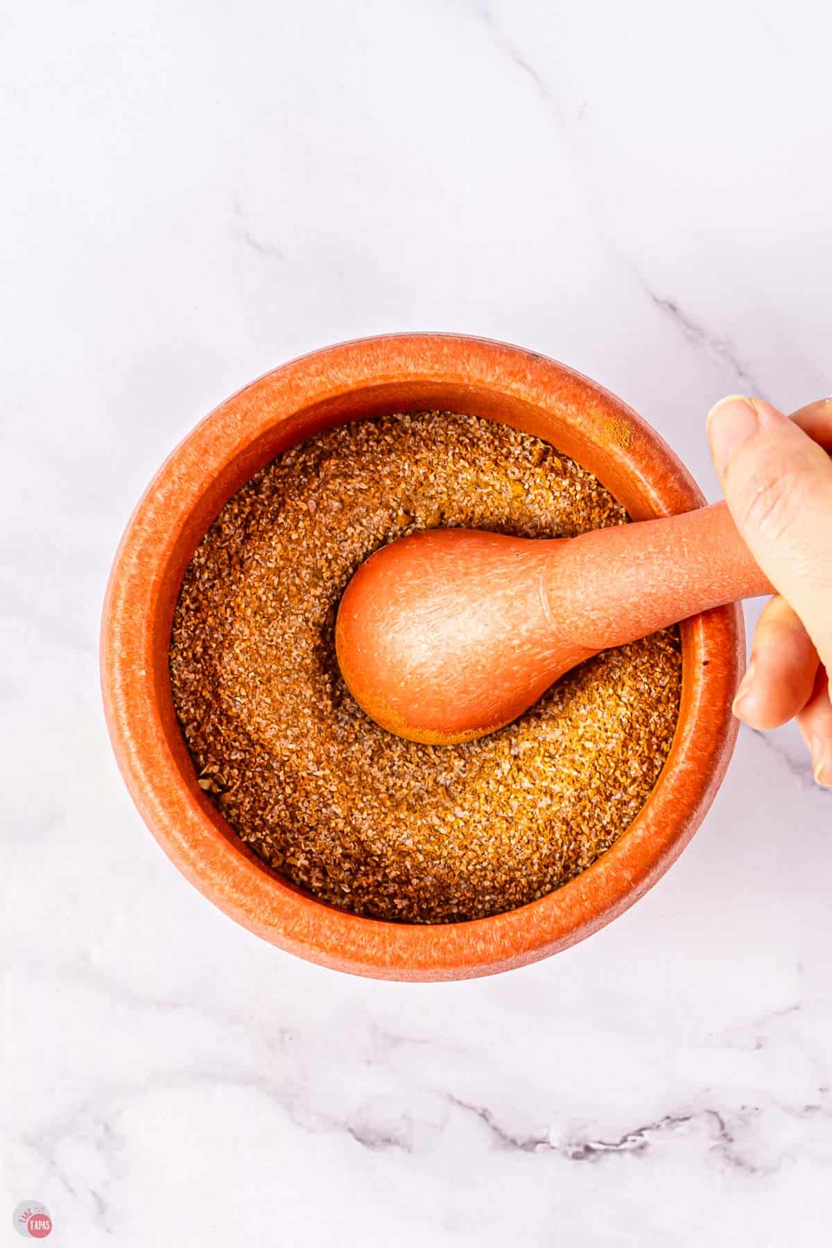 mortar and pestle with spices in it