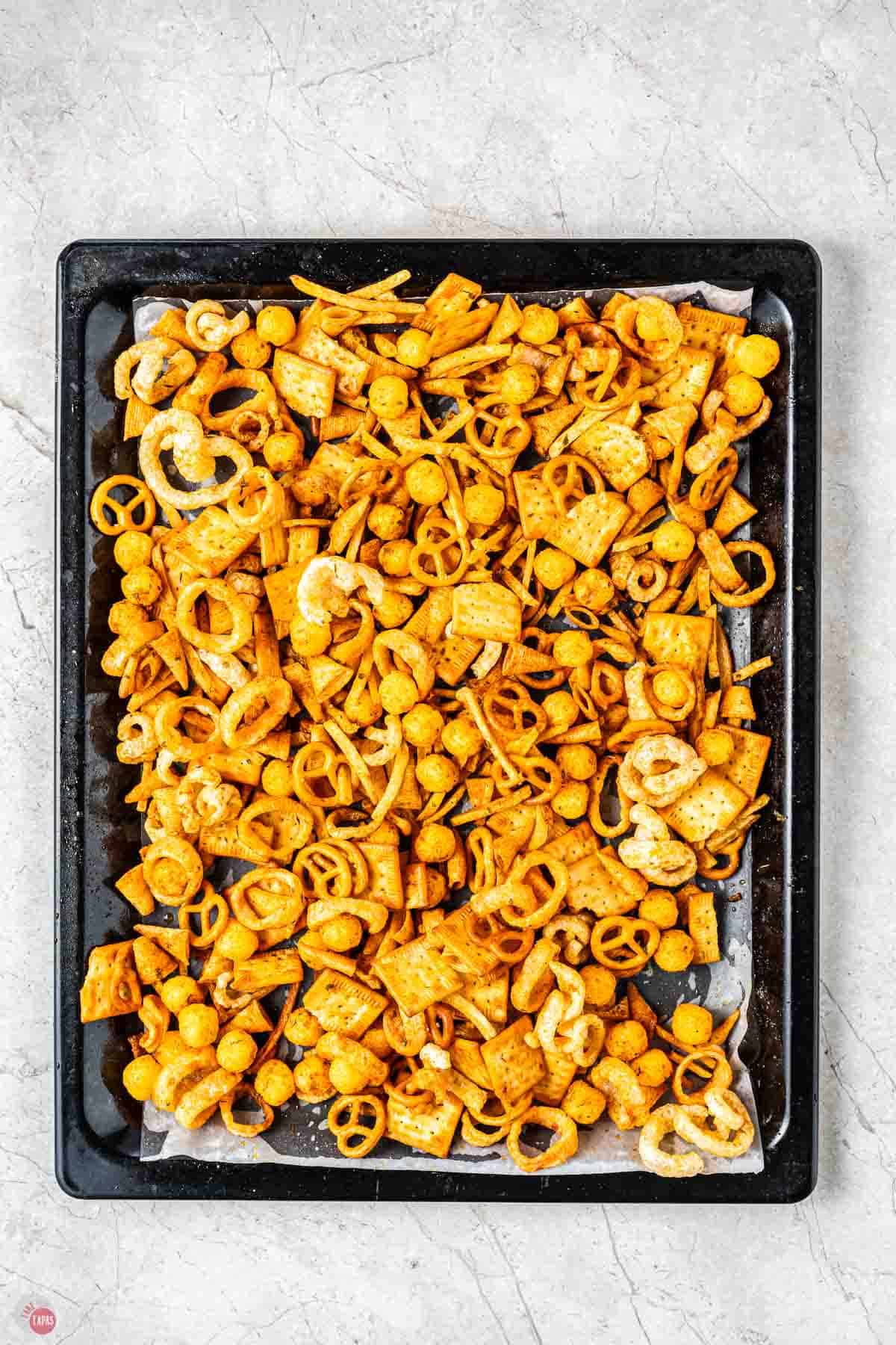 baked snack mix on a baking sheet
