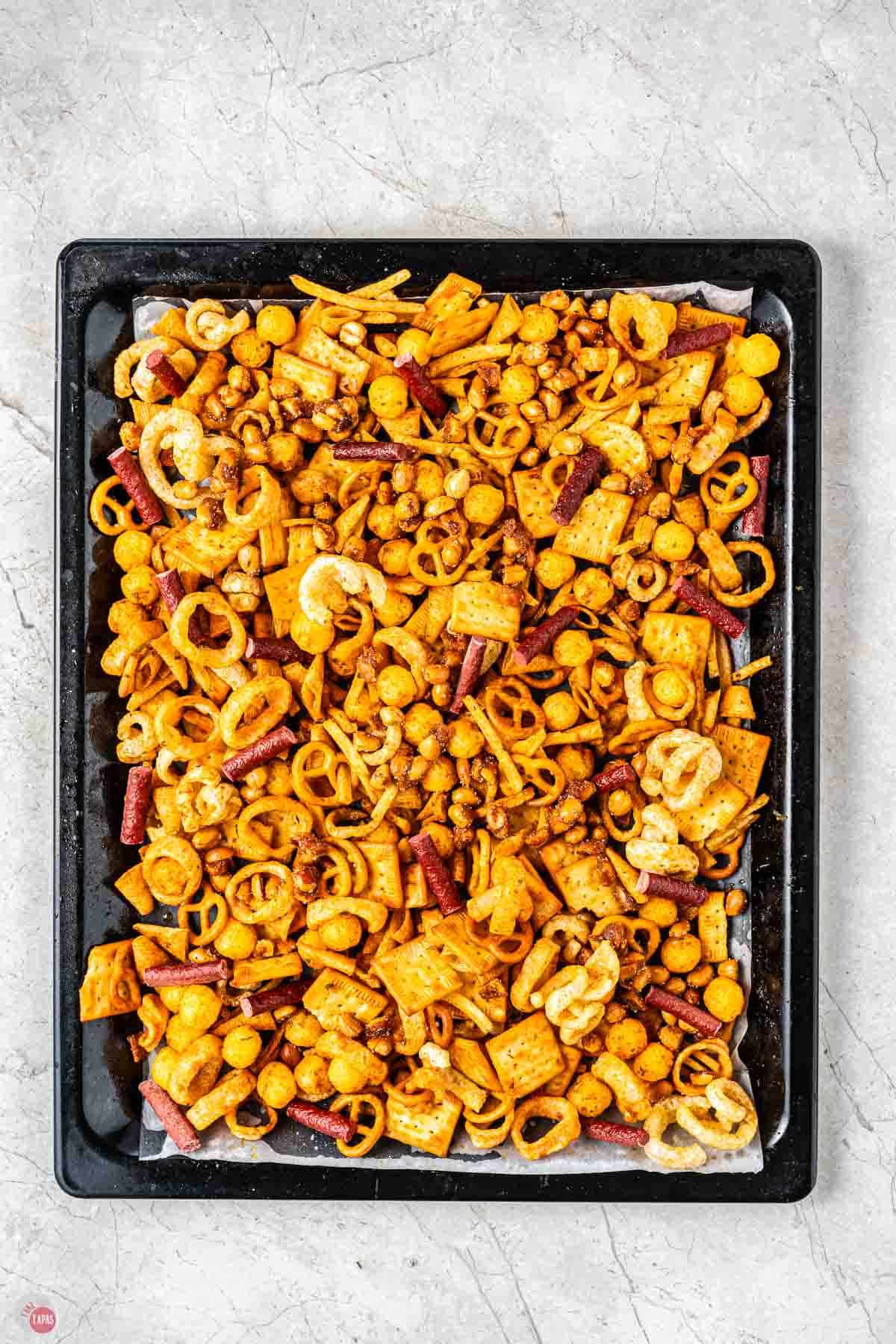 bar snack mix on a baking sheet