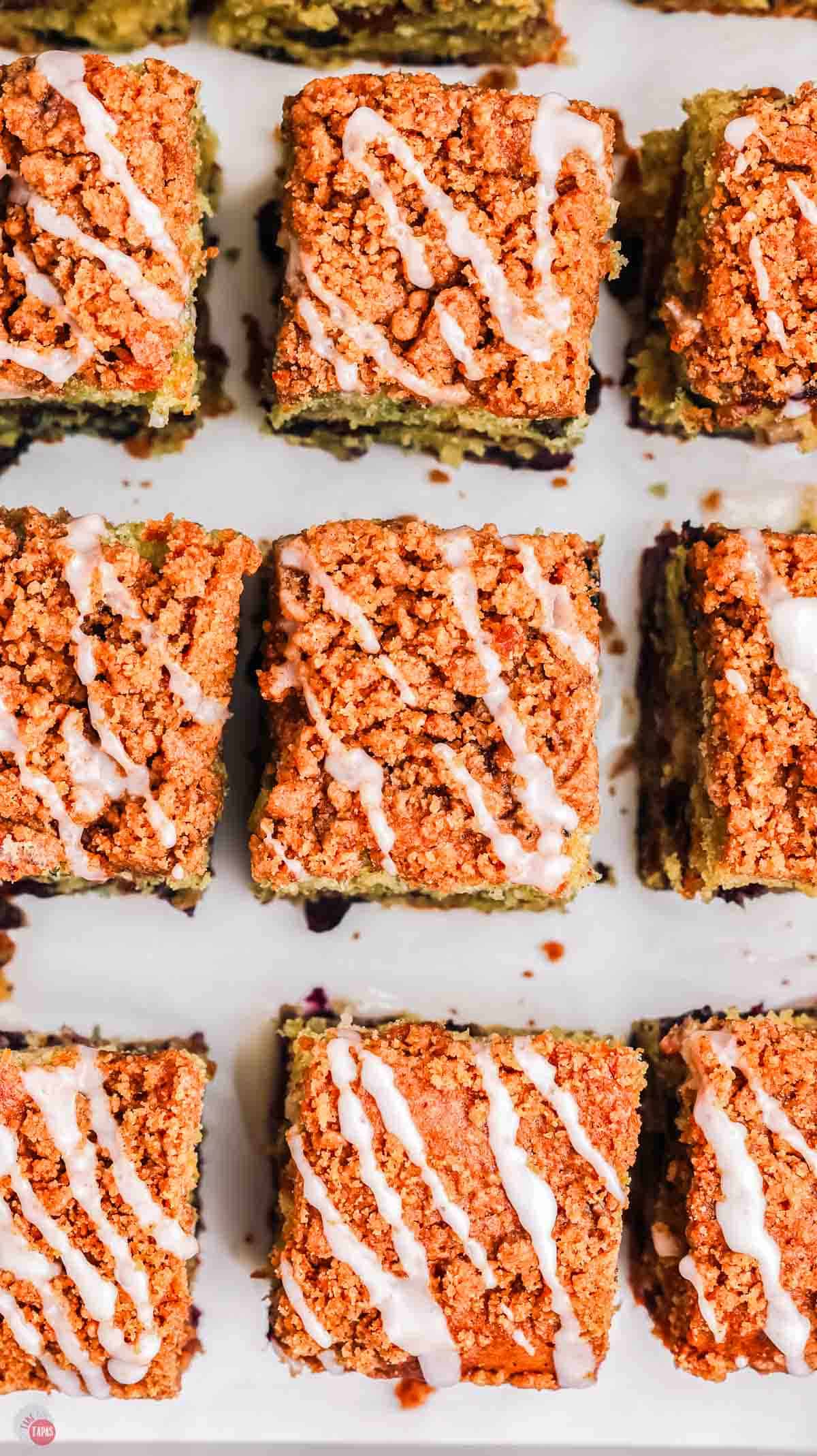 close up of slices of cake with icing on top