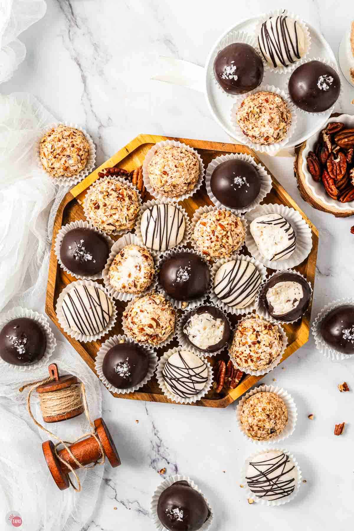 wood platter of bourbon balls with various coatings