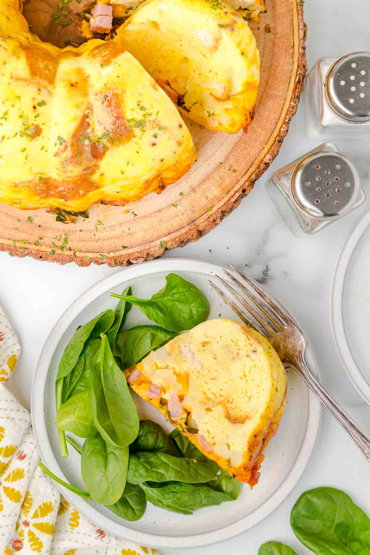 bundt cake made with breakfast foods and a plate with a small slice
