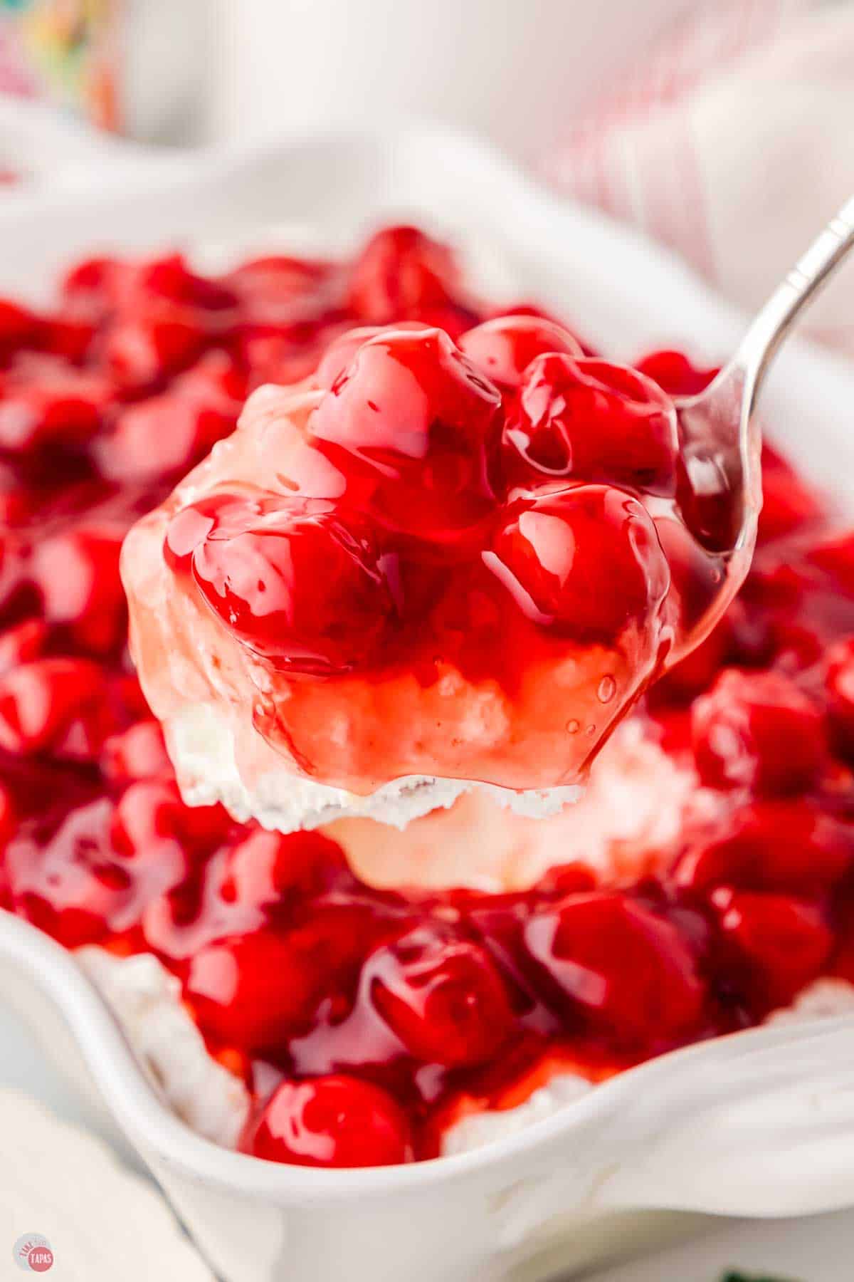 close up of cherry and cream dessert