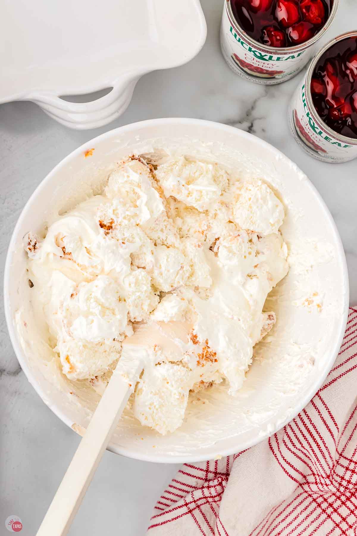 bowl of cake and whipped cream mixed together