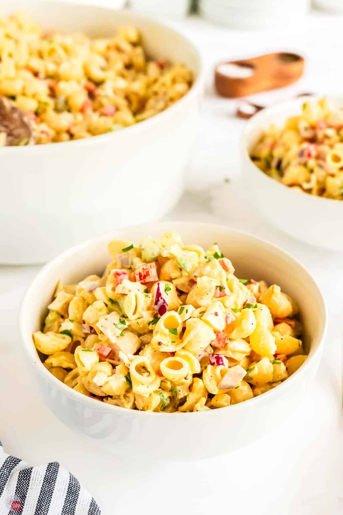 two bowls of pasta salad