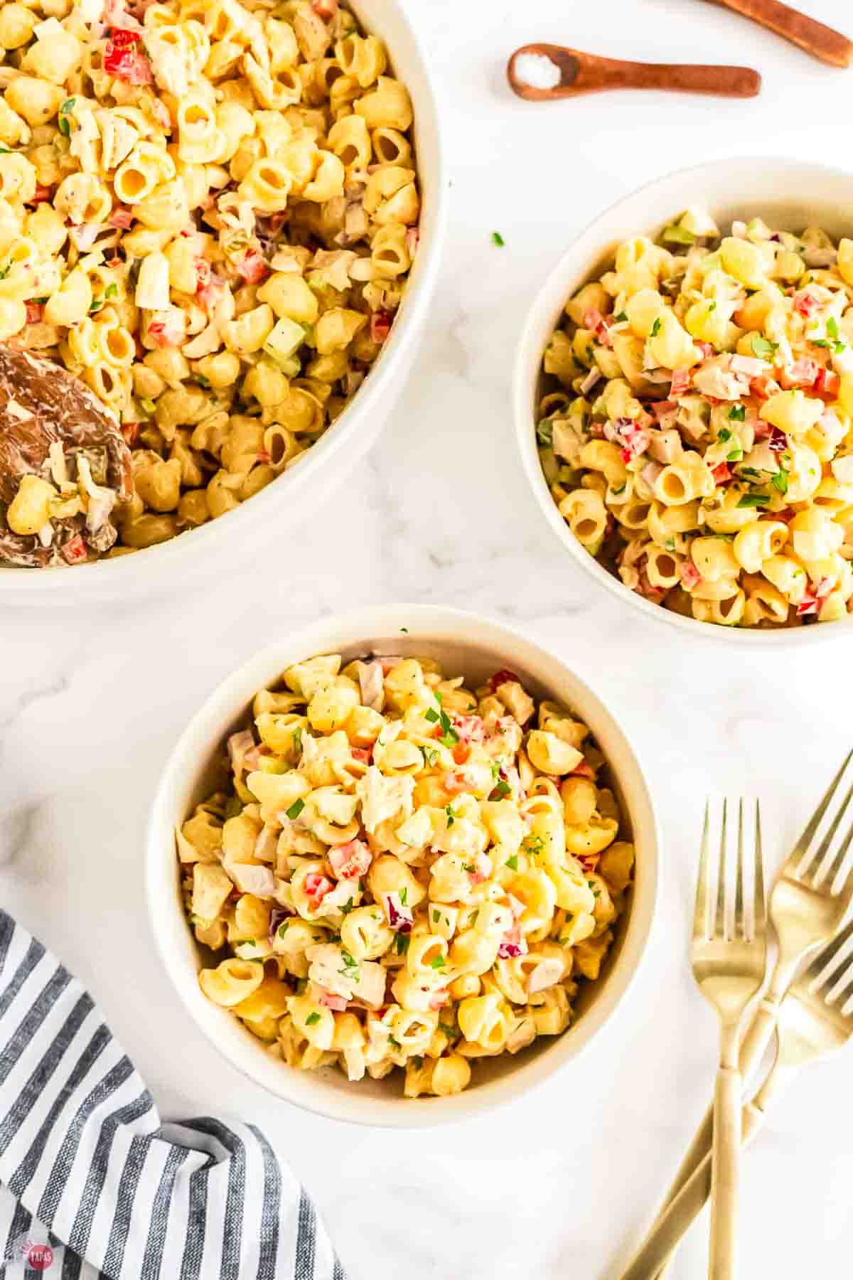 three bowls of macaroni salad with diced chicken