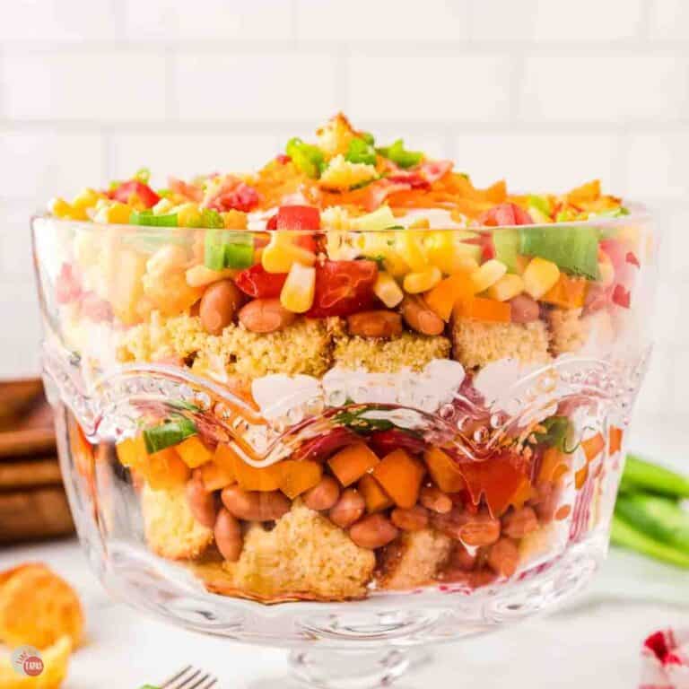 clear bowl with salad in it displayed in layers