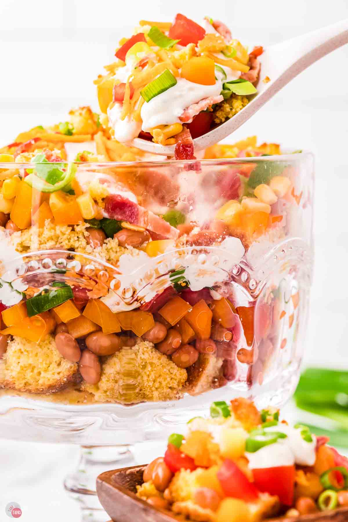 spoon scooping salad out of a bowl