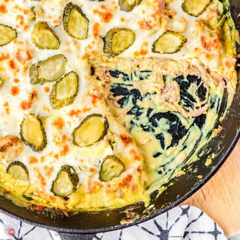 Cuban casserole in a skillet with a wedge removed