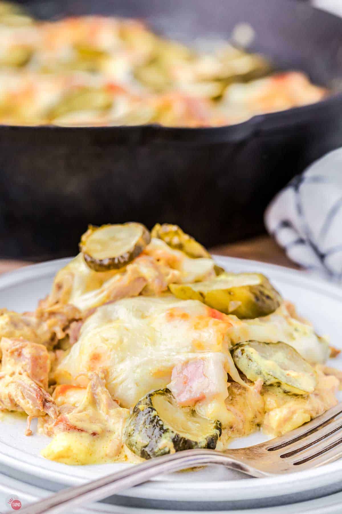 close up of plate with a deconstructed cuban sandwich on it