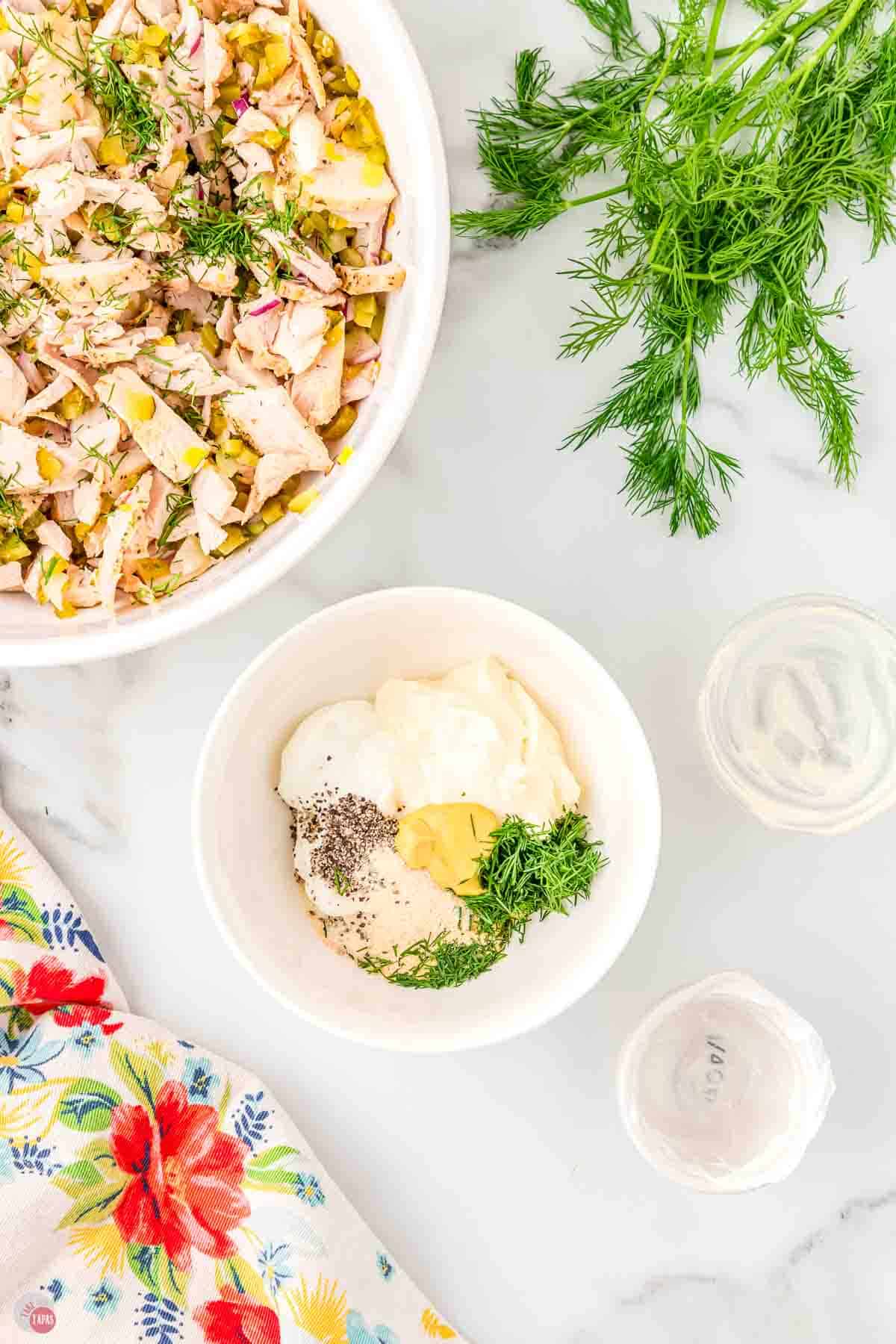 small white bowl with mayo and some spices