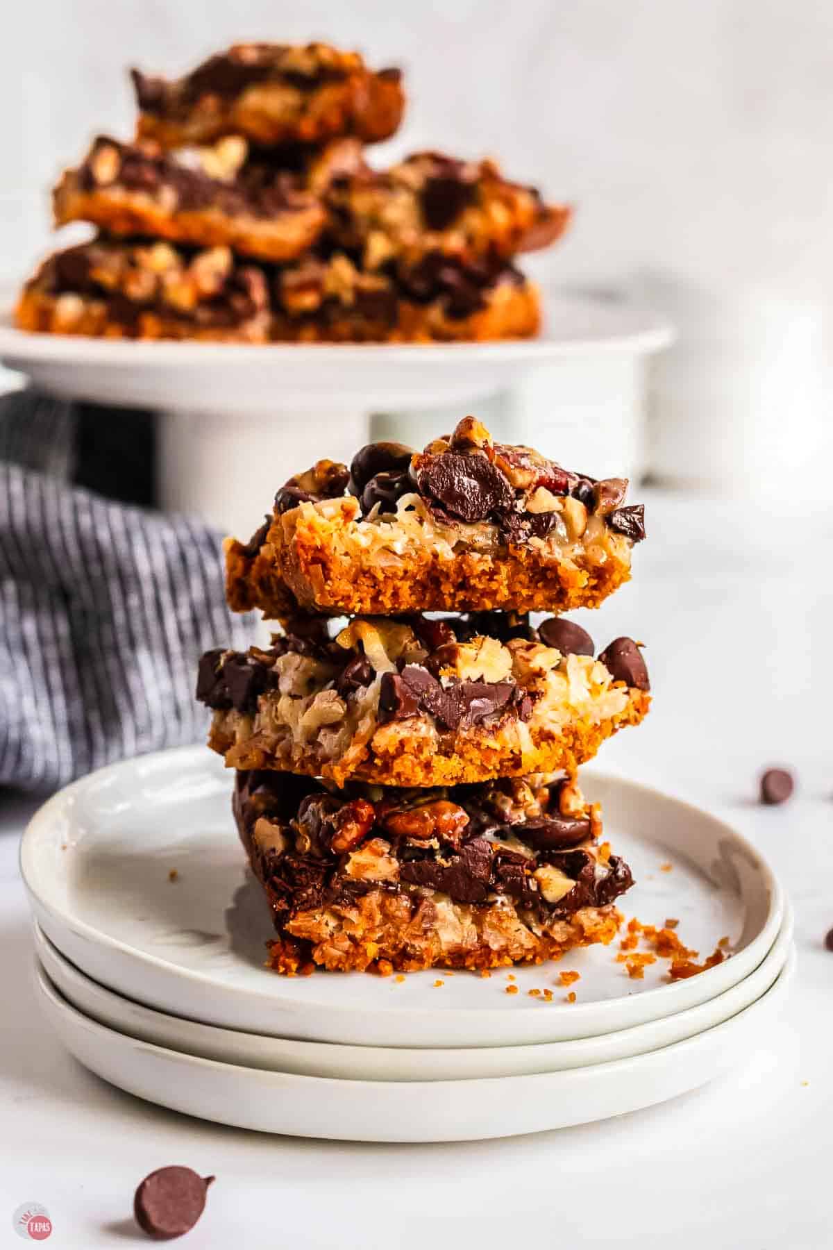 stack of magic cookie bars on a stack of plates