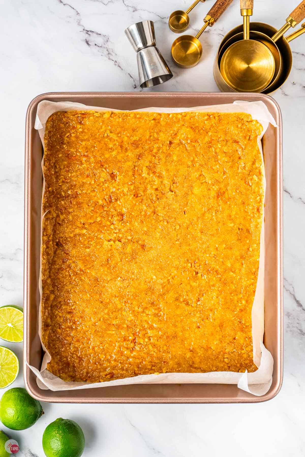 baked pretzel crust in a square baking pan