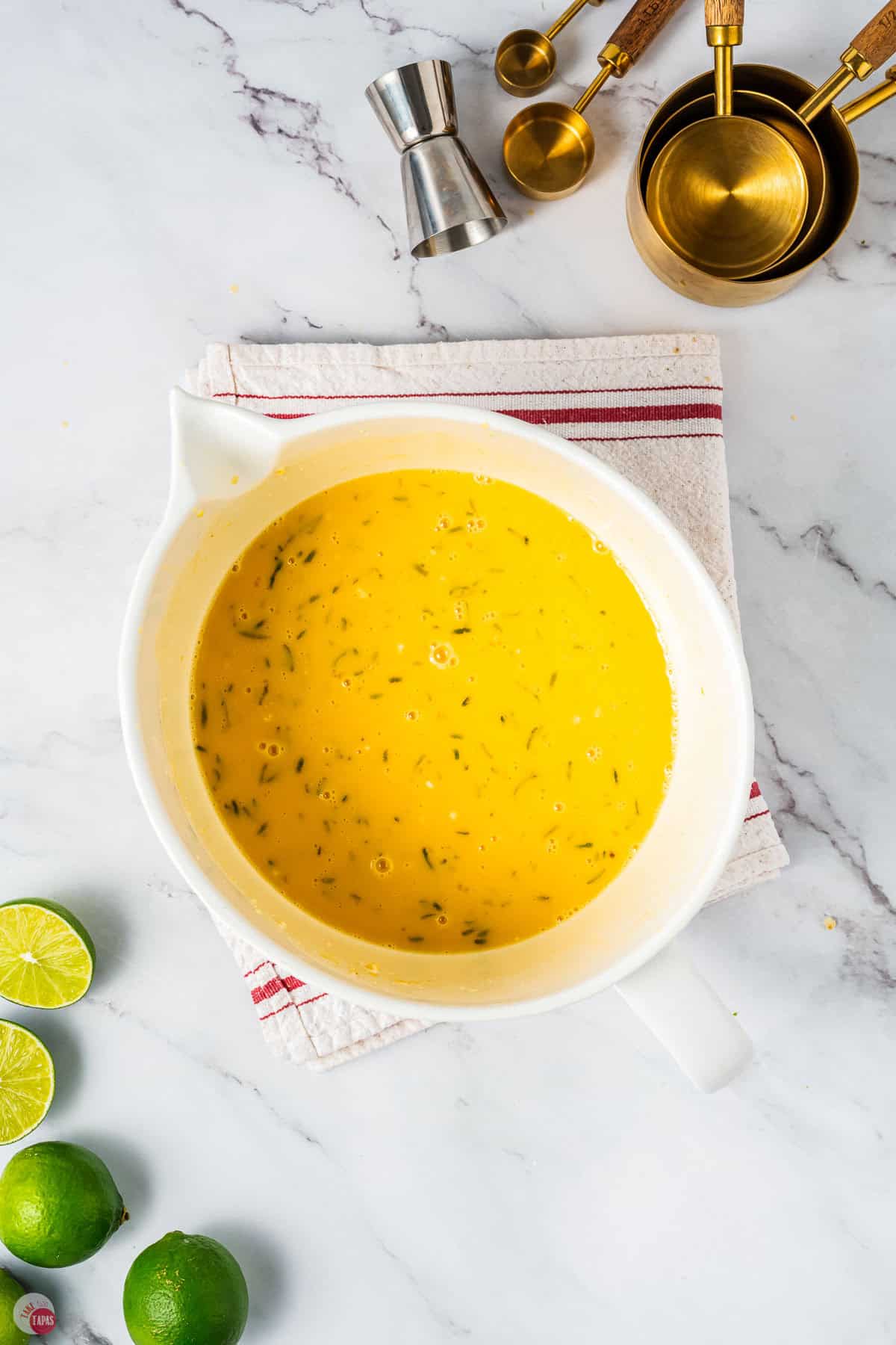 bowl of mixed lime filling on a white towel with a red stripe