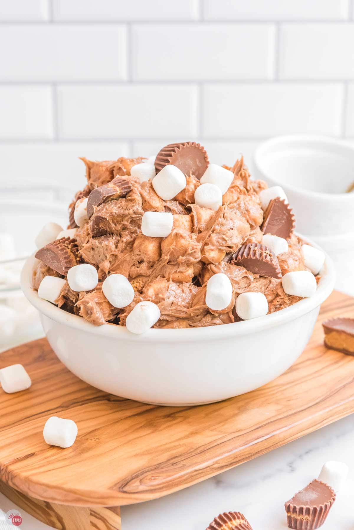 close up of bowl of chocolate pudding, peanut butter cups, and marshmallows