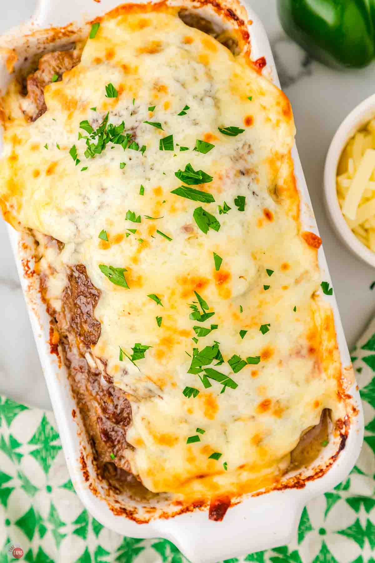 baked meatloaf topped with cheese