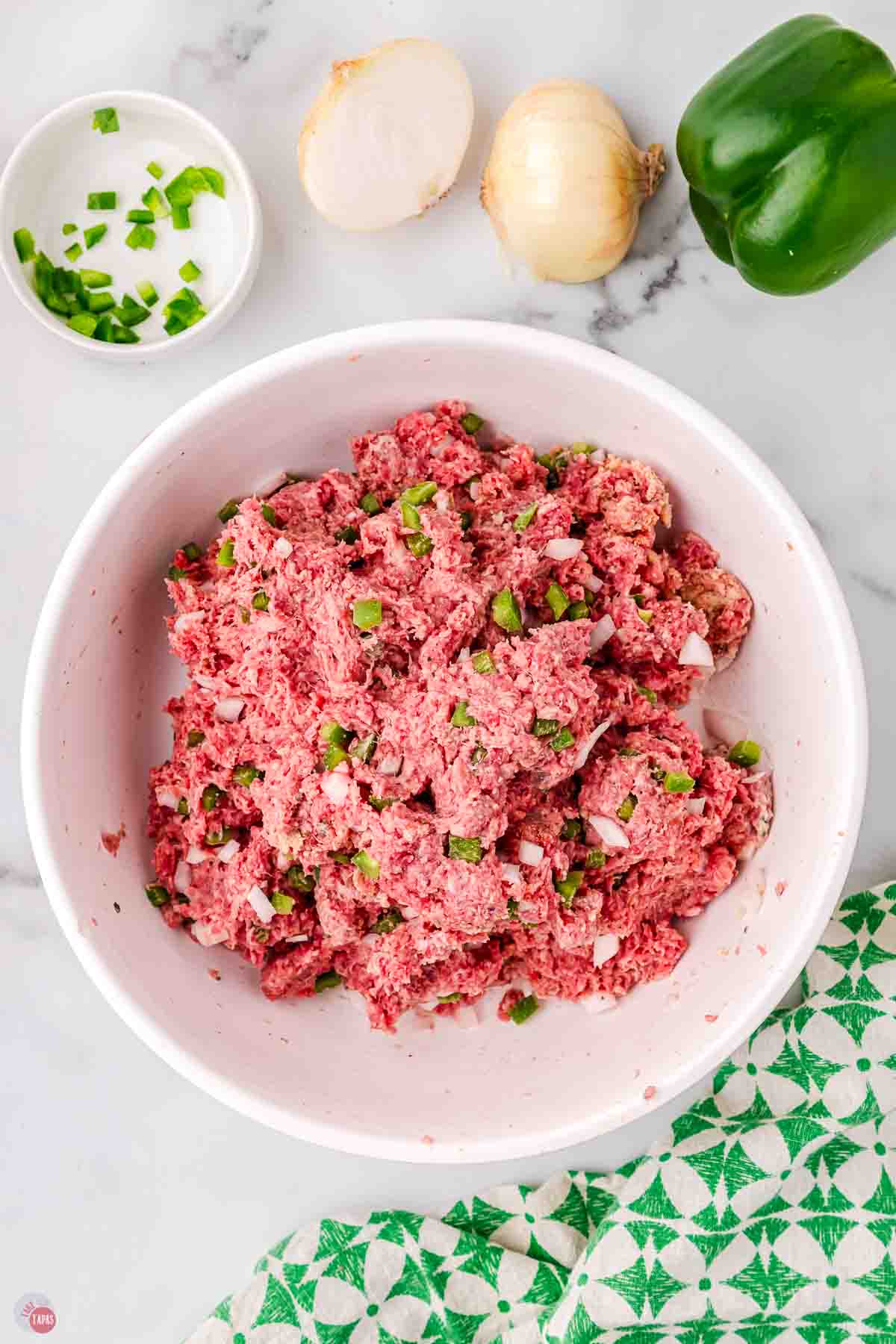 meatloaf mixture in a white mixing bowl