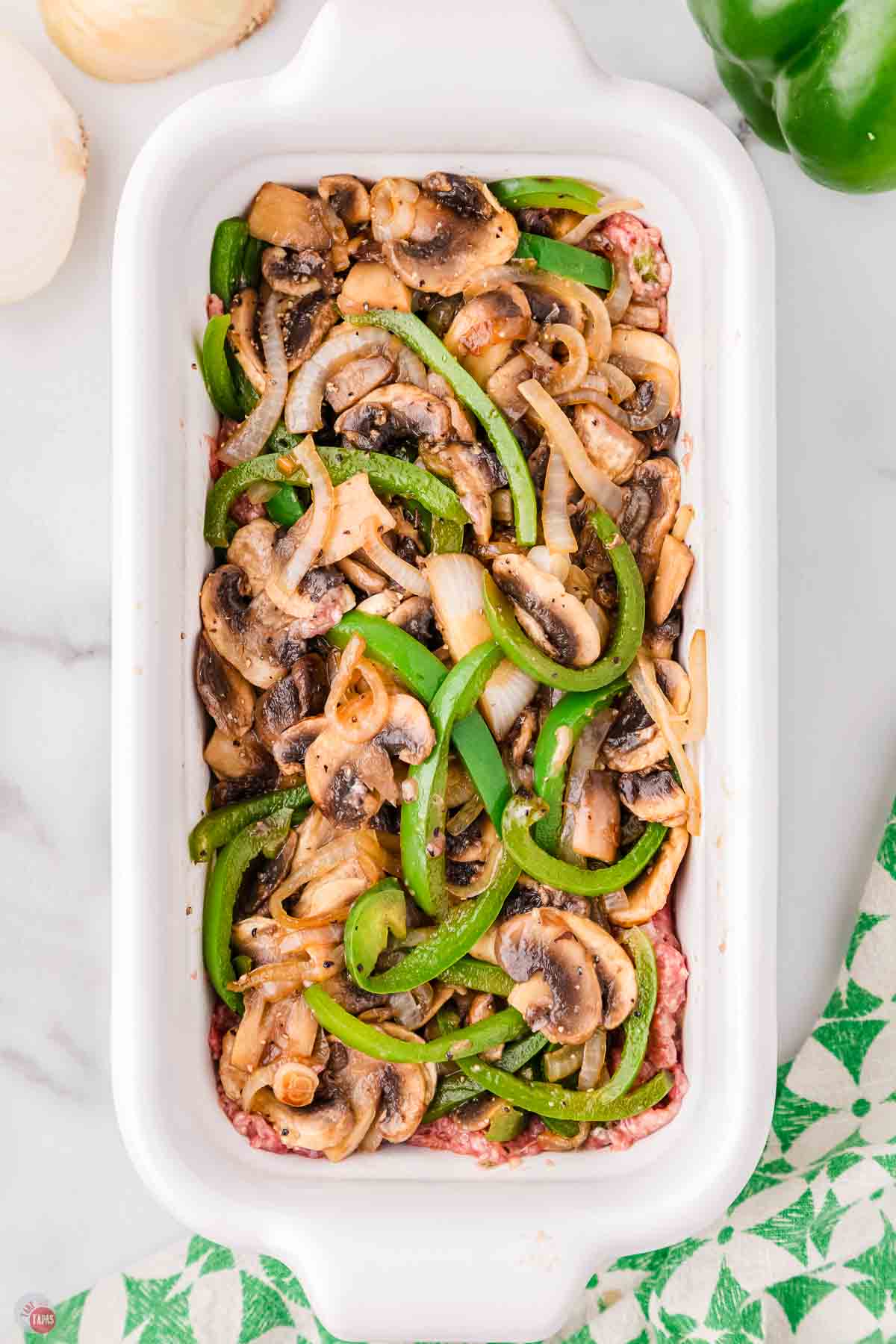 cooked peppers and onions in a loaf pan