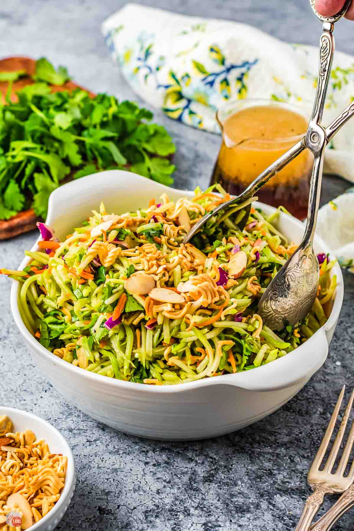white bowl of broccoli slaw with ramen noodles