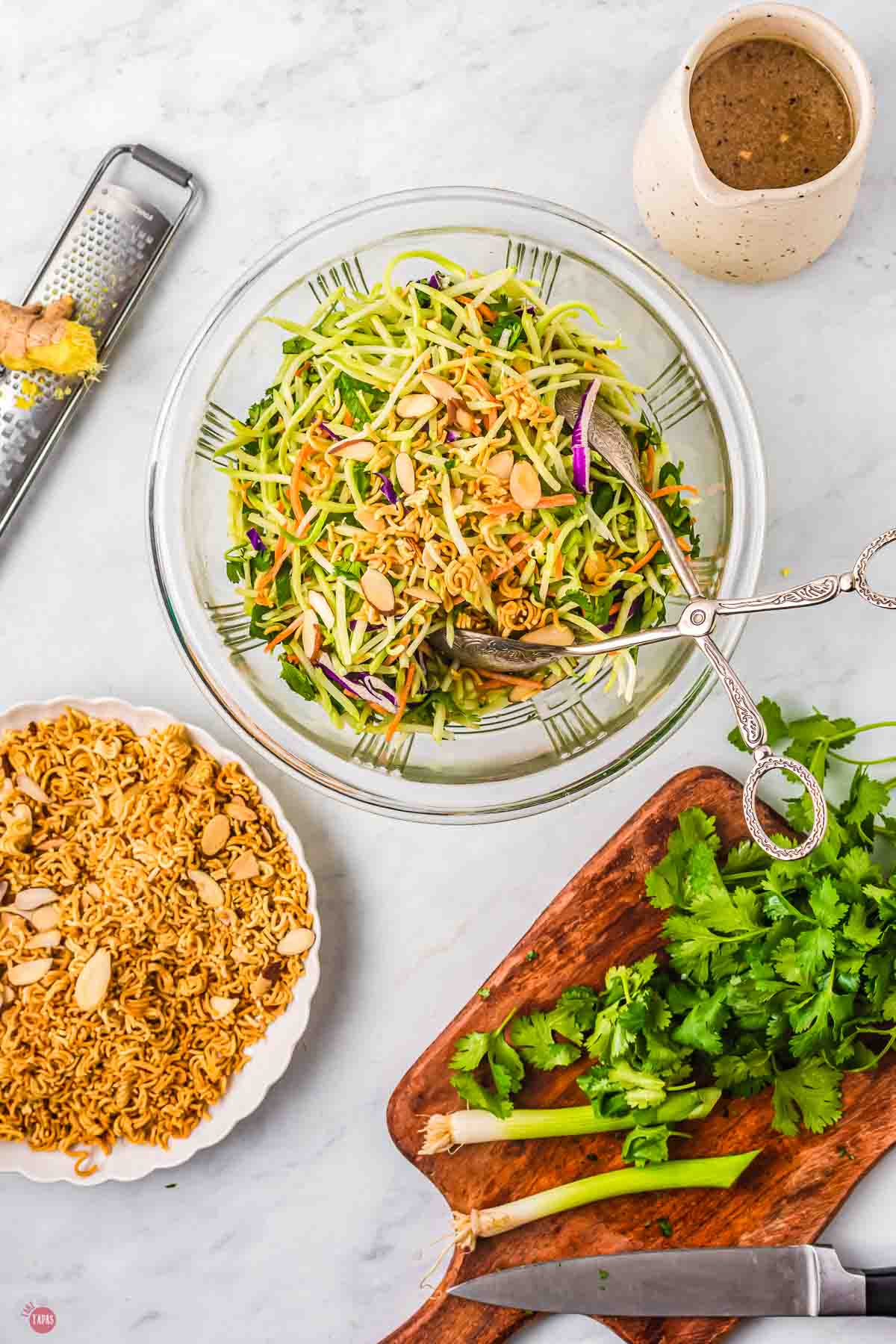 bowl of slaw with cutting board of cilantro