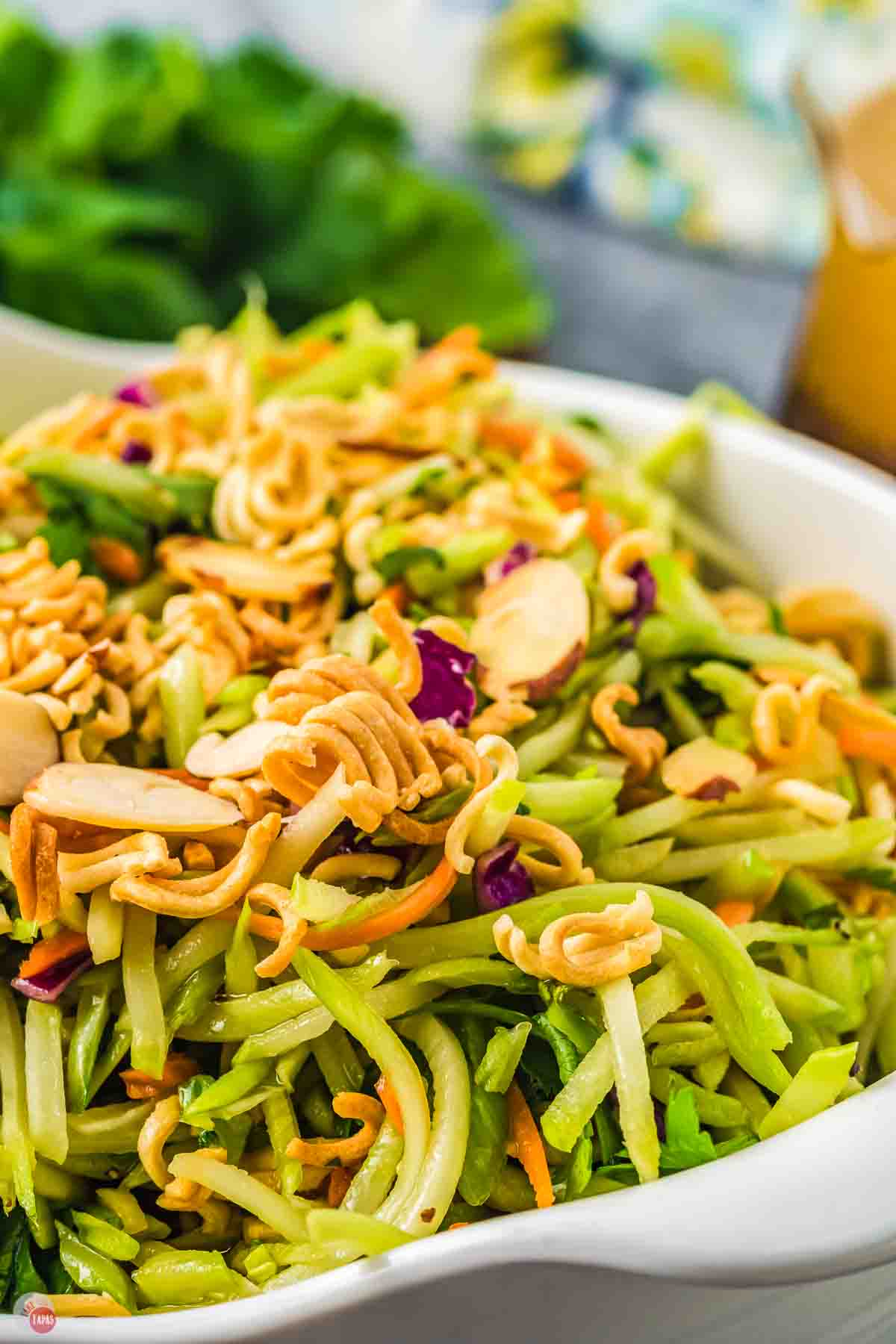 close up of crunchy ramen noodles on top of broccoli slaw