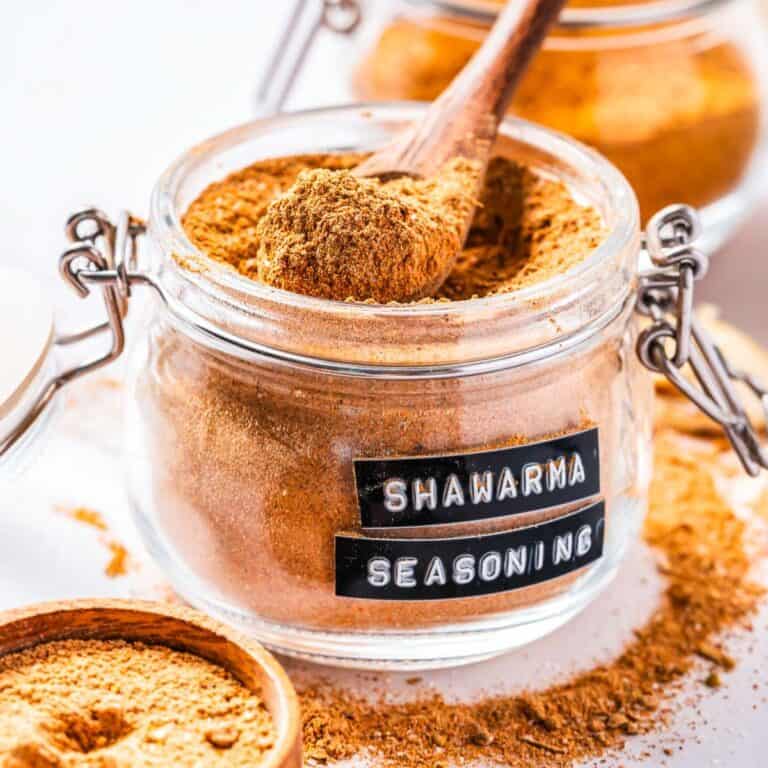jar of spices with a wood spoon