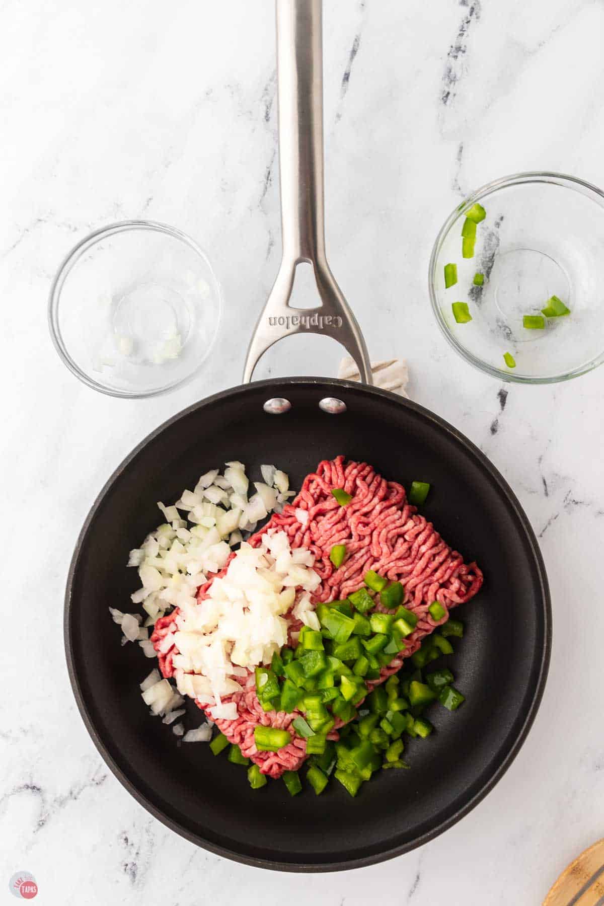 skillet with ground beef, onions, and bell peppers