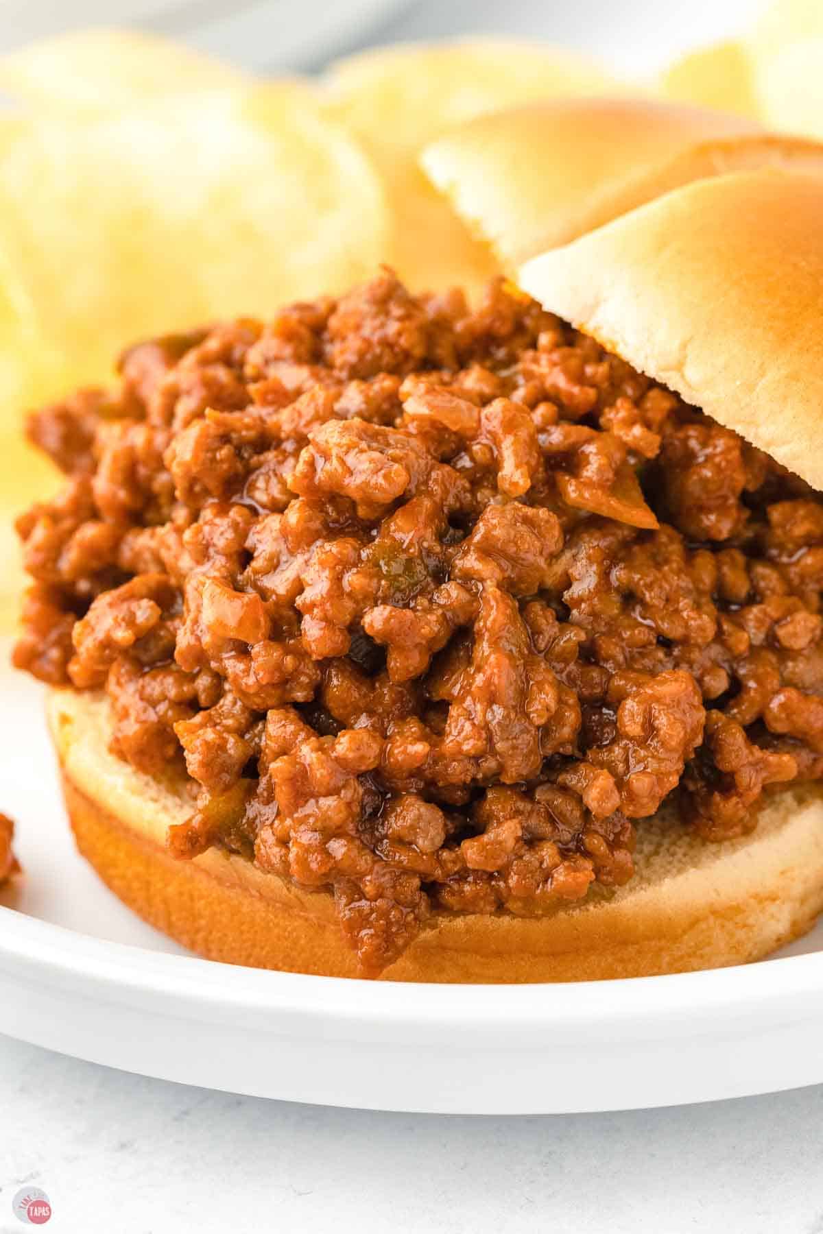 close up of sloppy joe with the top bun coming off