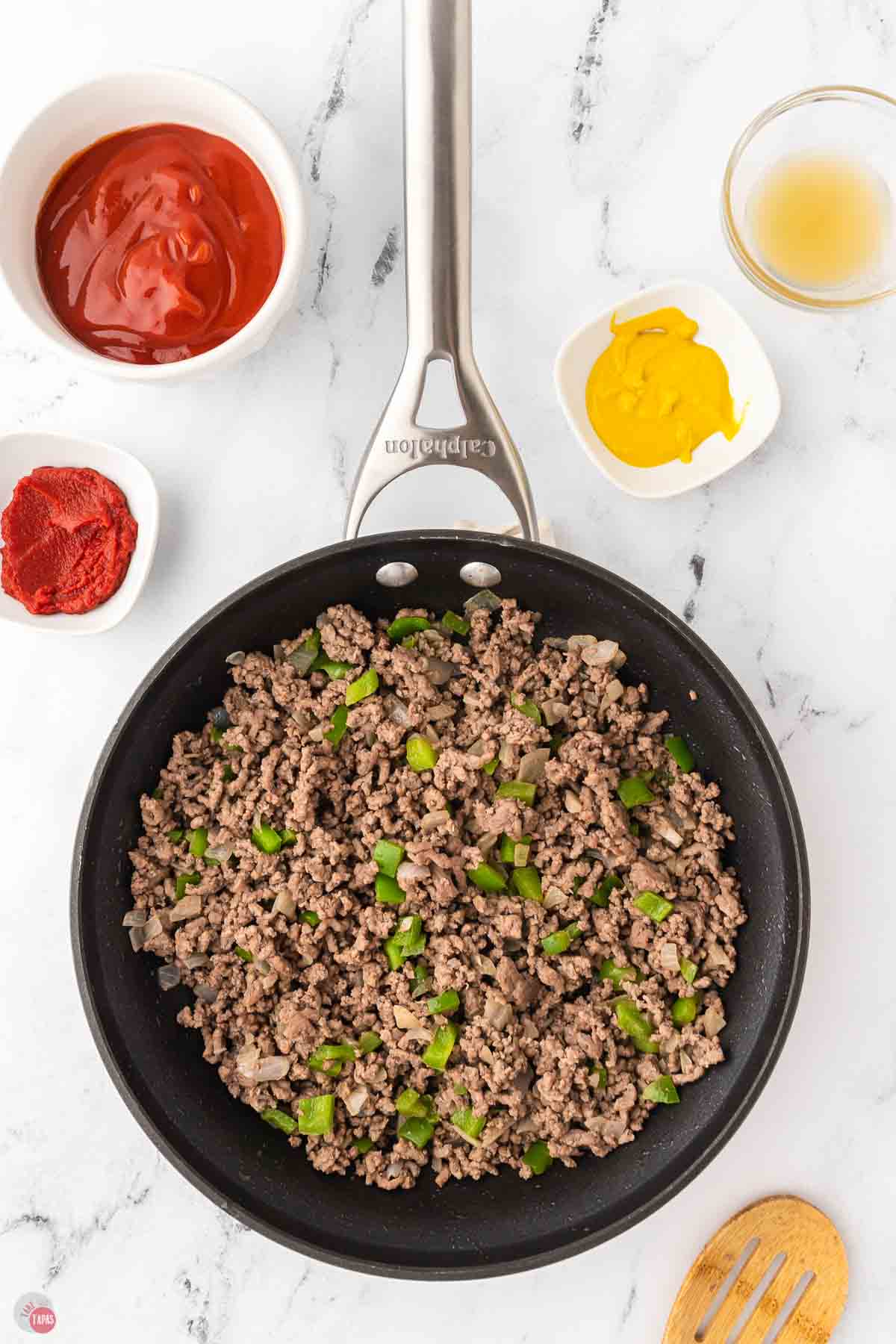 cooked ground beef and vegetables in a skillet