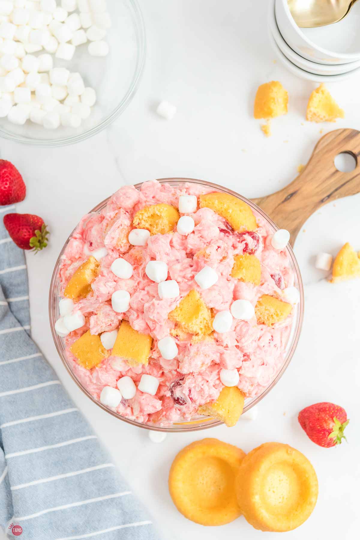 clear bowl with strawberry fluff and cake pieces on top