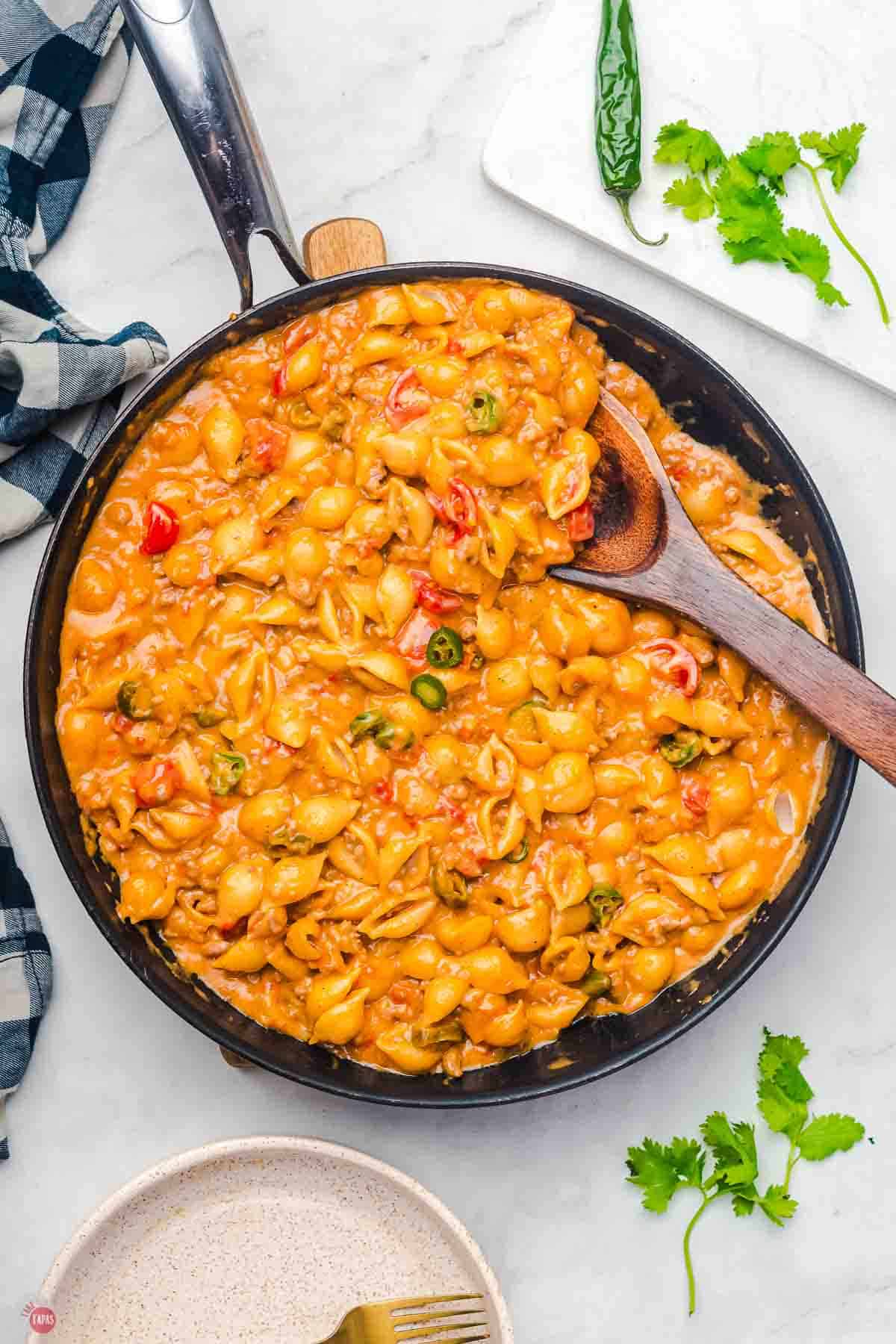 skillet of cheesy taco mac with pasta shells