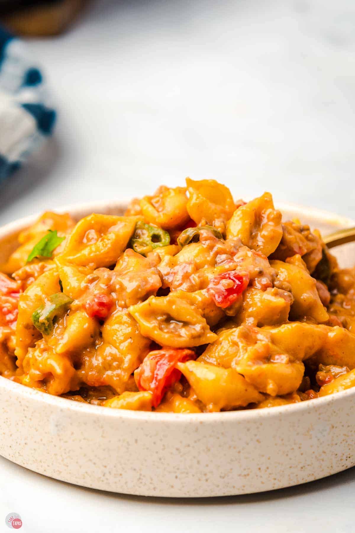 side view close up of white bowl with skillet pasta recipe in it