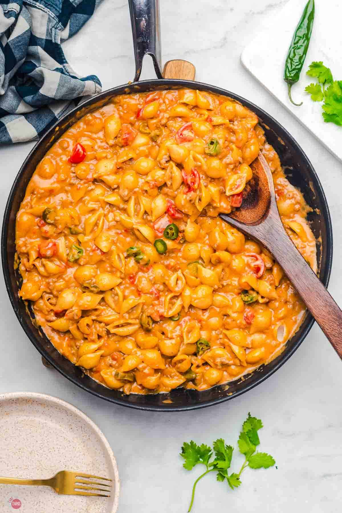 skillet with pasta, taco meat, and tomatoes