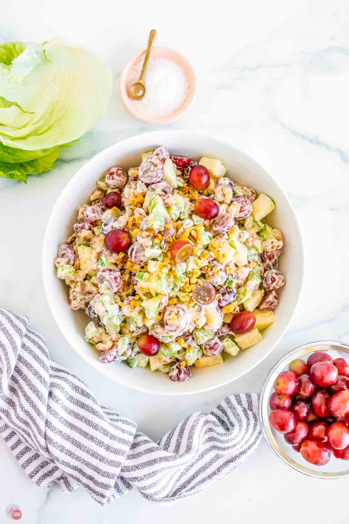 bowl of fruit mixed with a creamy dressing
