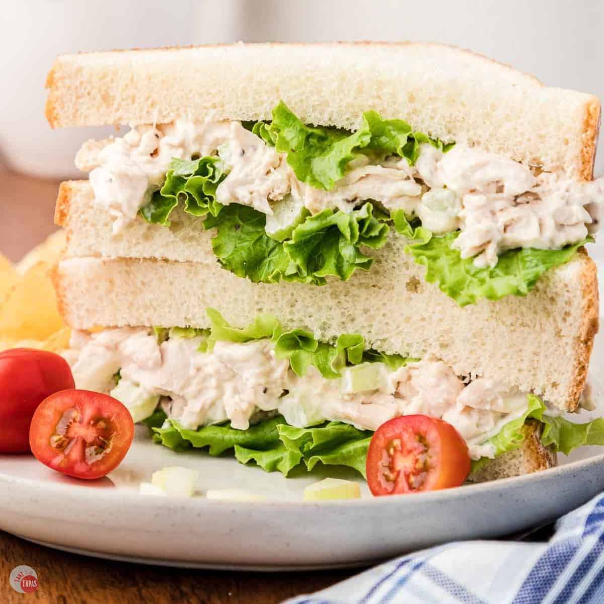 stack of cut chicken salad sandwiches