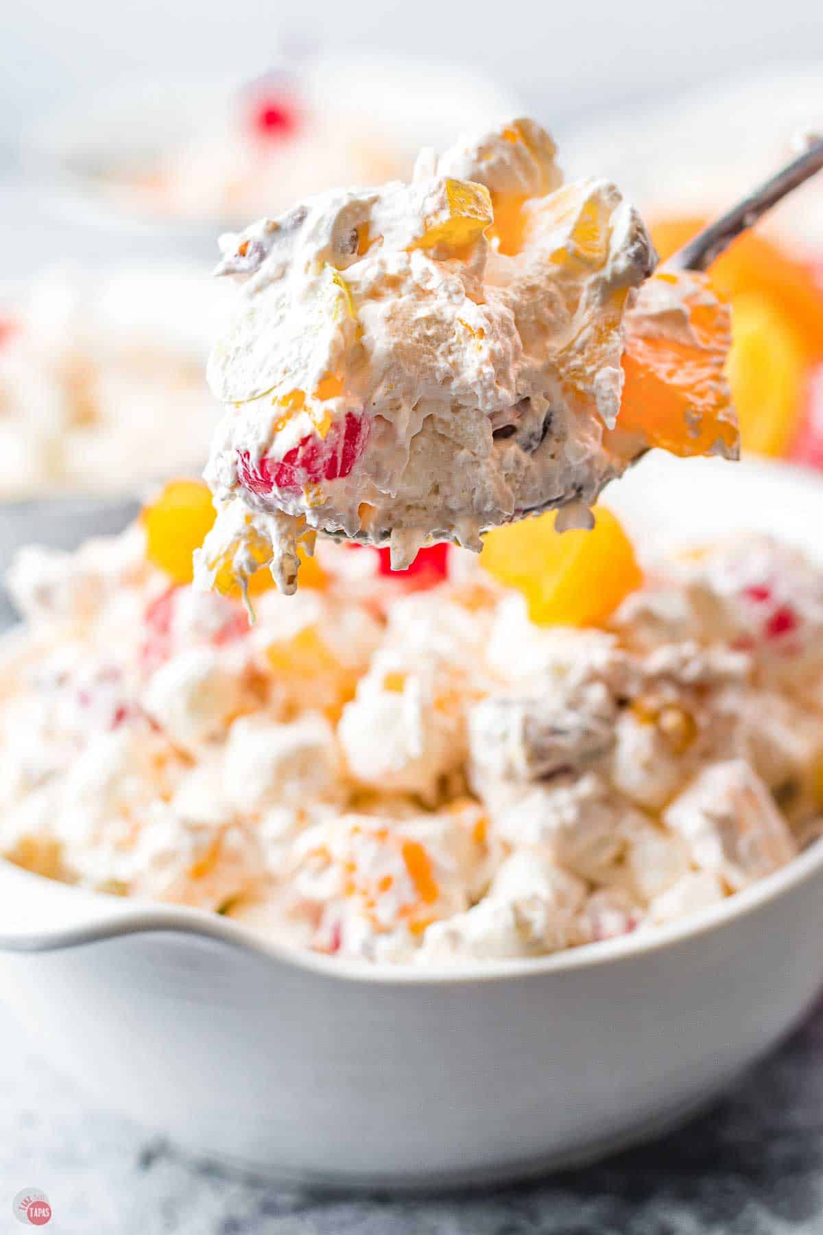 spoon of fruit and whipped topping