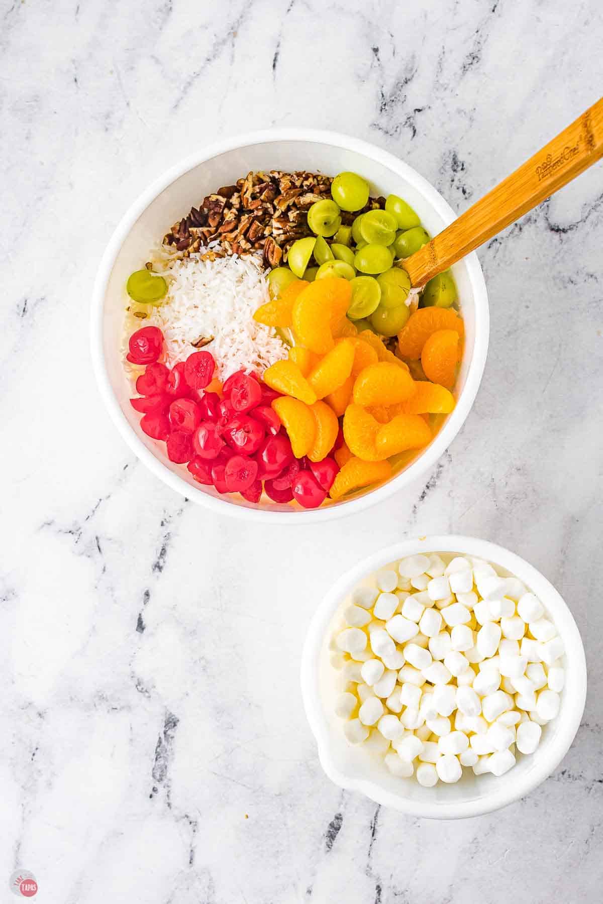 two bowls of fruit and marshmallows