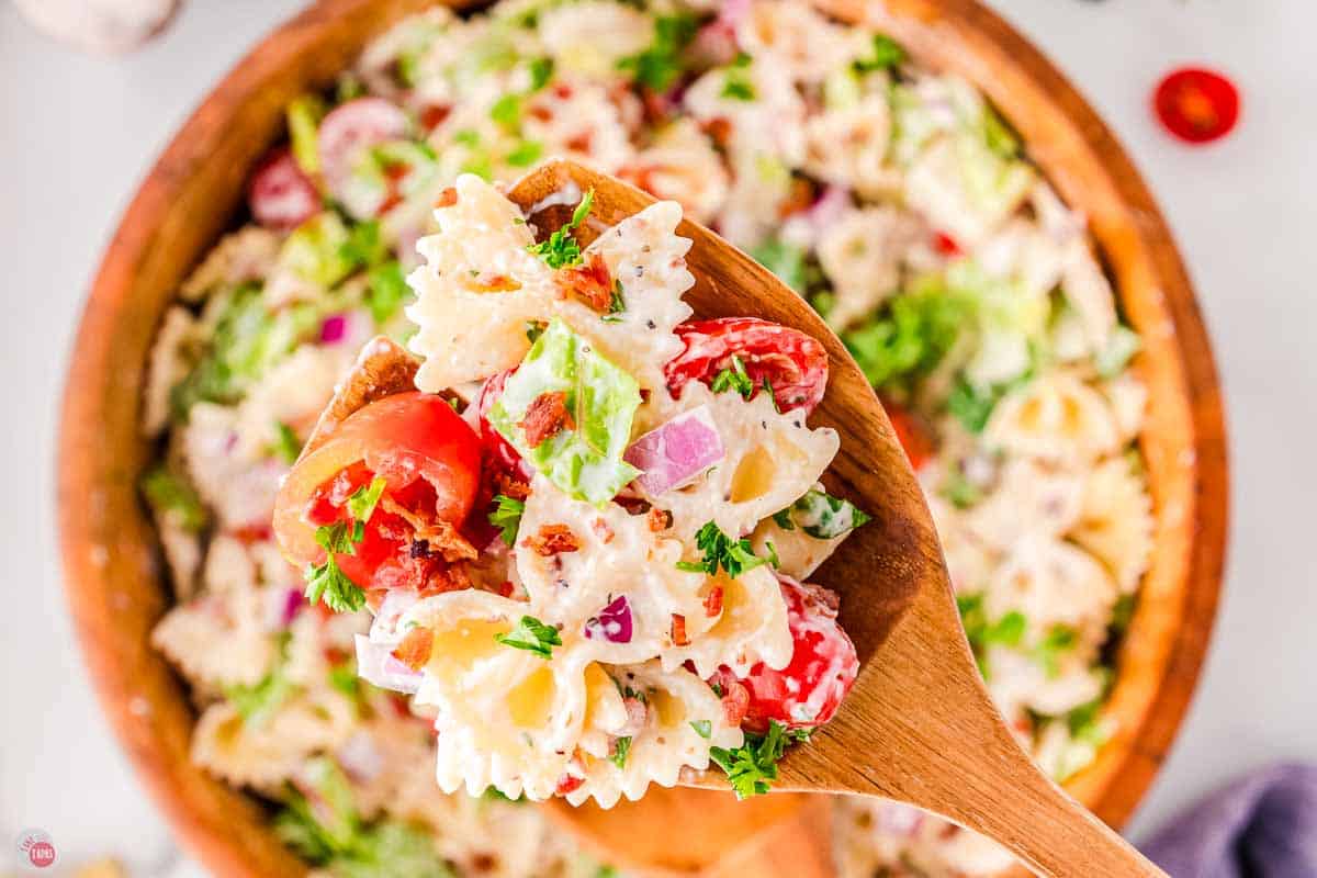 close up of bowtie pasta, bacon, tomatoes, and lettuce