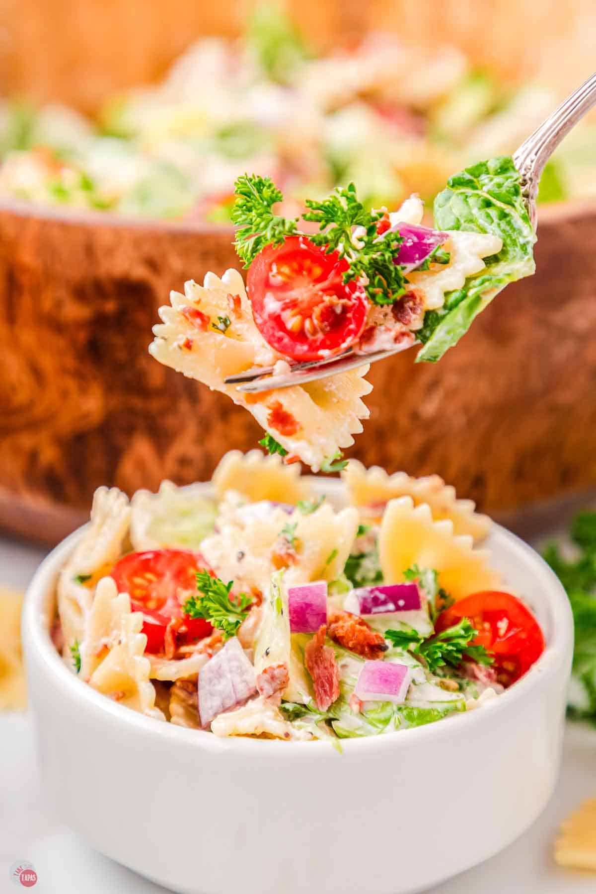 fork with bite of BLT pasta salad on it
