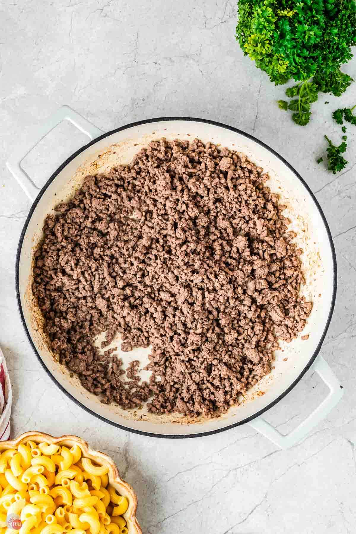 cooked ground beef in a white pot