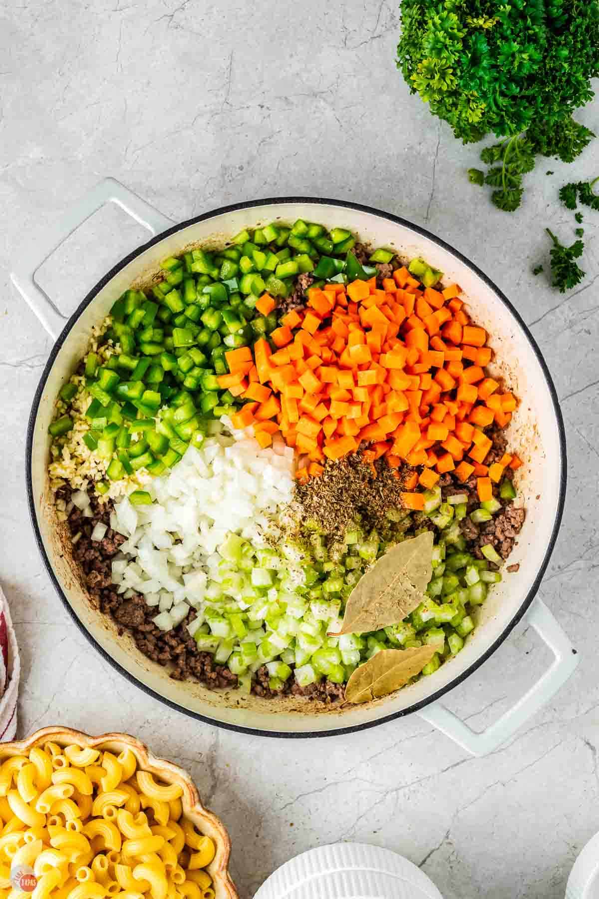 white pot of assorted chopped vegetables