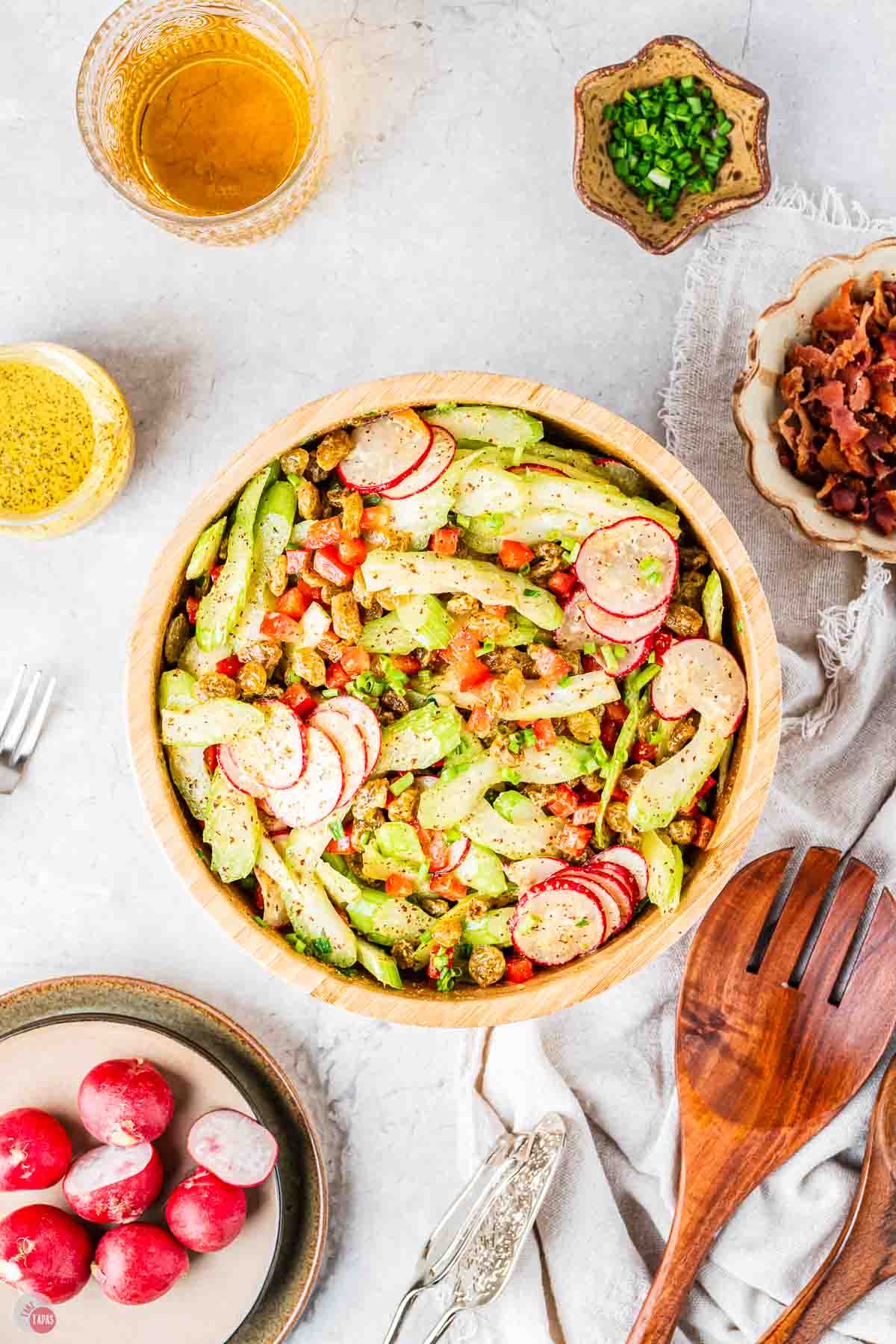 crispy celery slaw in a wood bowl