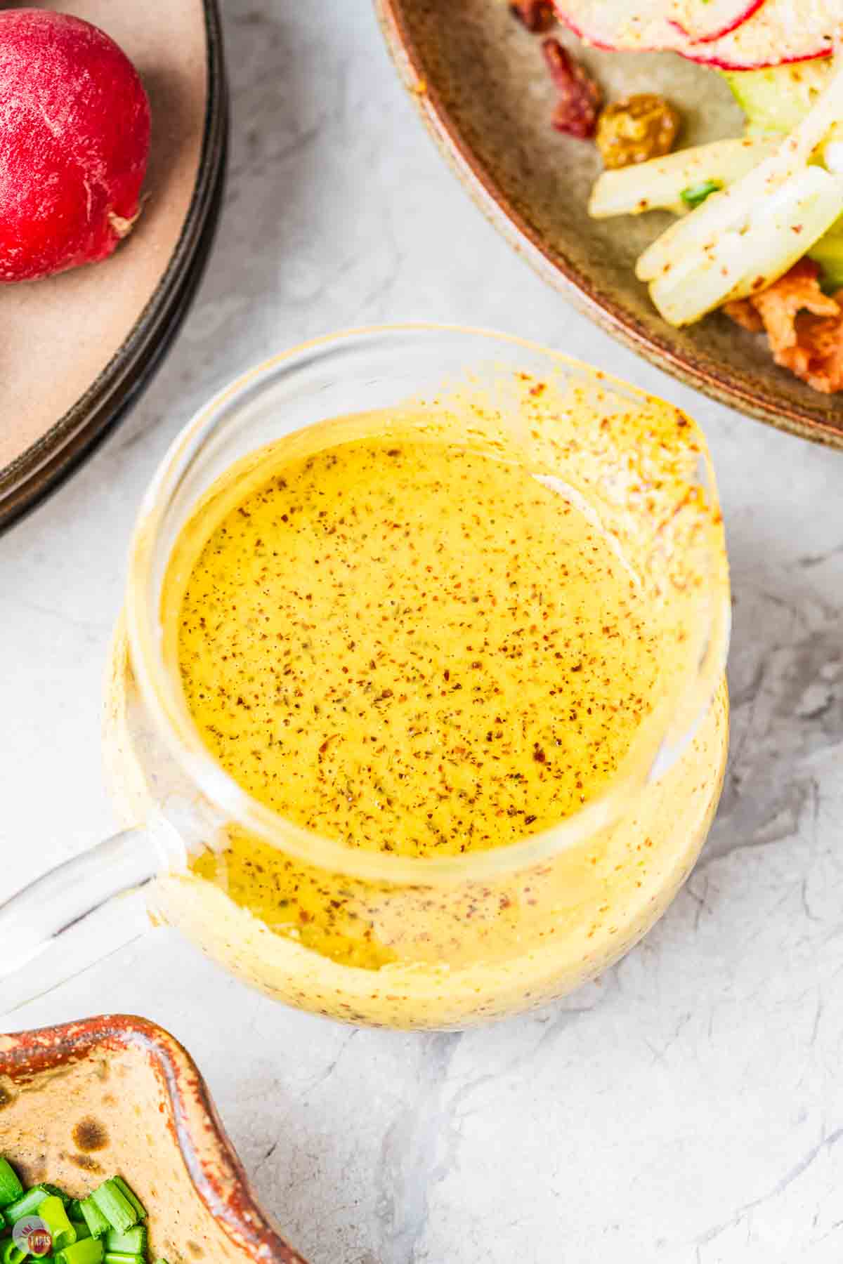 close up of salad dressing in a small bowl