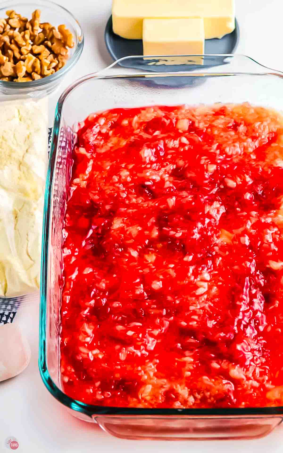clear baking dish with cherry fruit mixture in it