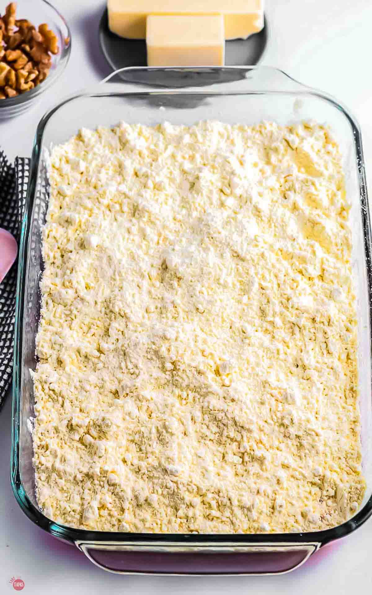 baking dish with cake mix powder in it
