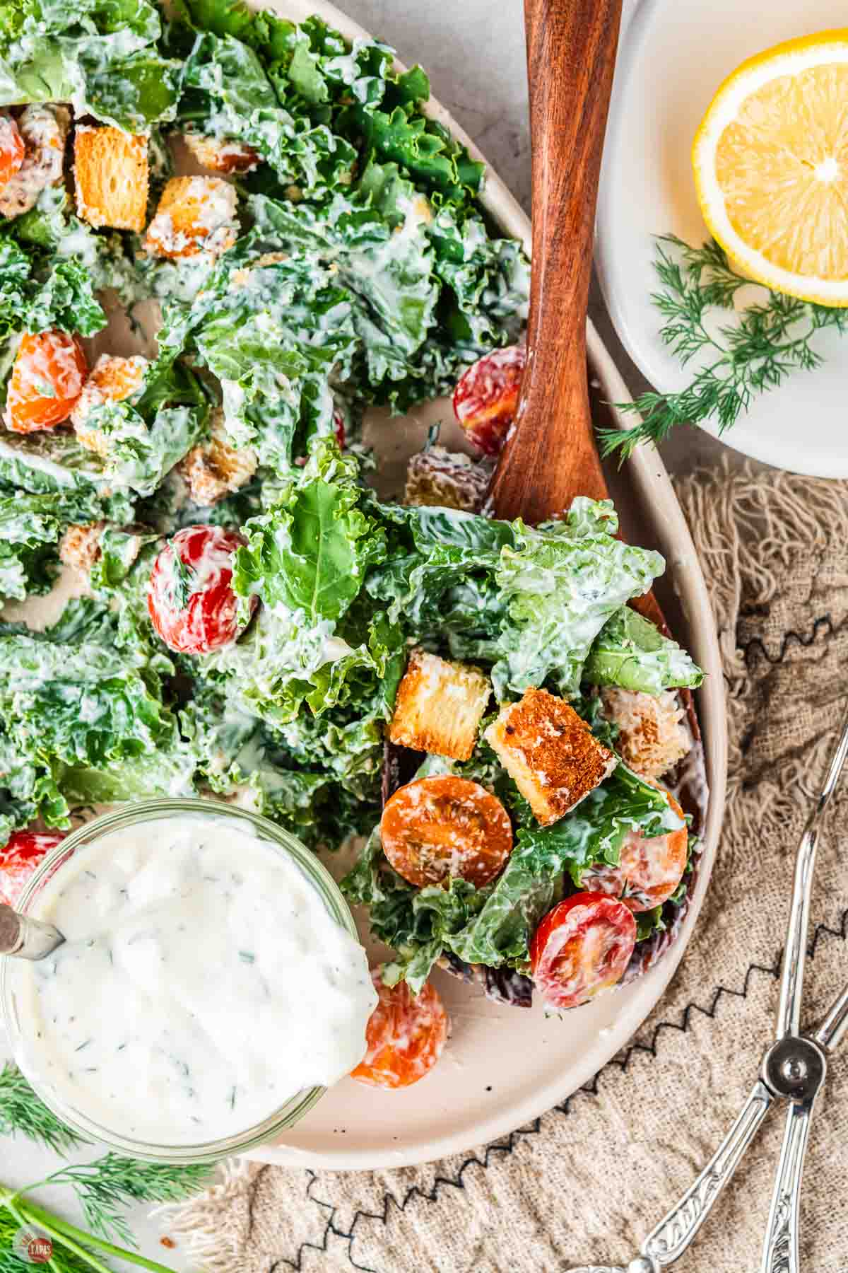 close up of salad with wood spoon