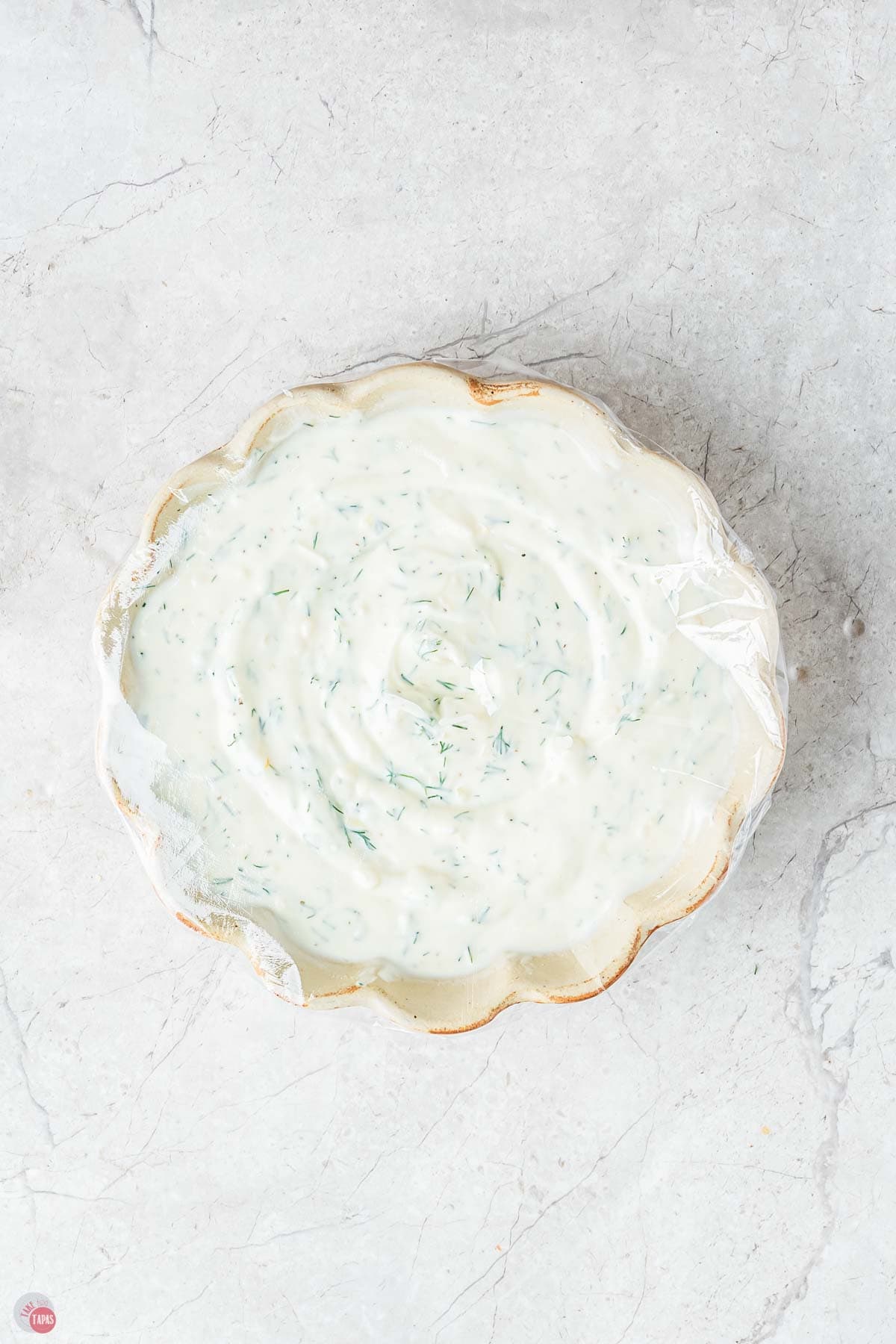 shallow bowl of creamy salad dressing