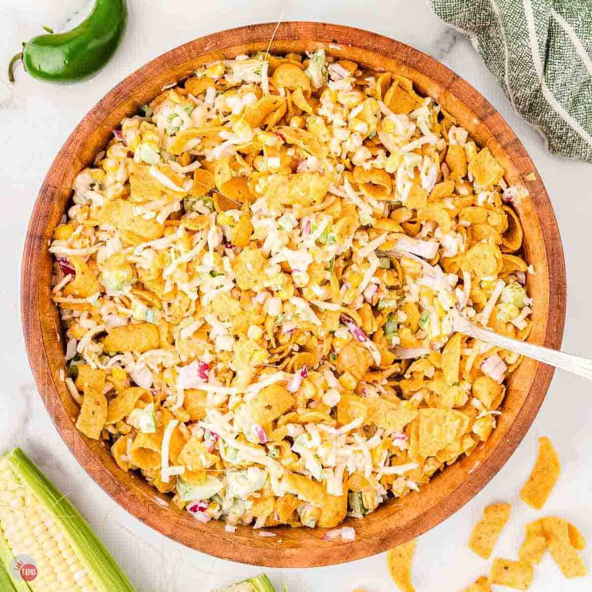 wood bowl with corn and corn chip salad